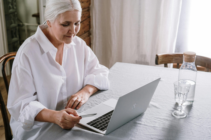 a woman opening a senior checking account from essential credit union