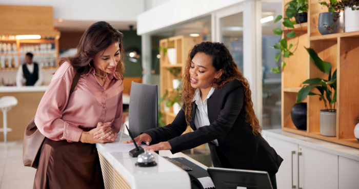 a woman opening a share certificate with essential credit union
